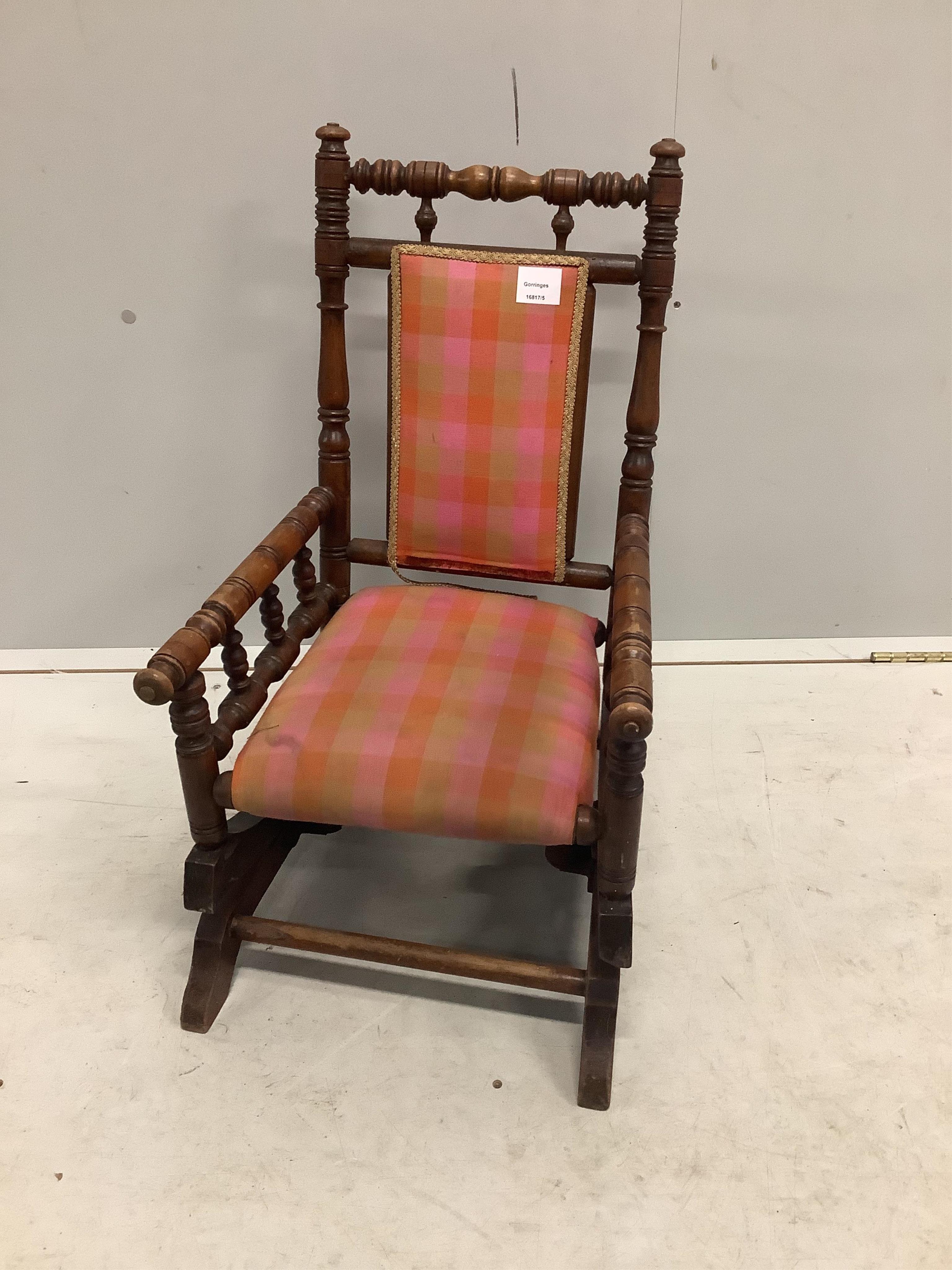 A late 19th century American turned beech child’s rocking chair, width 39cm, depth 49cm, height 66cm. Condition - fair